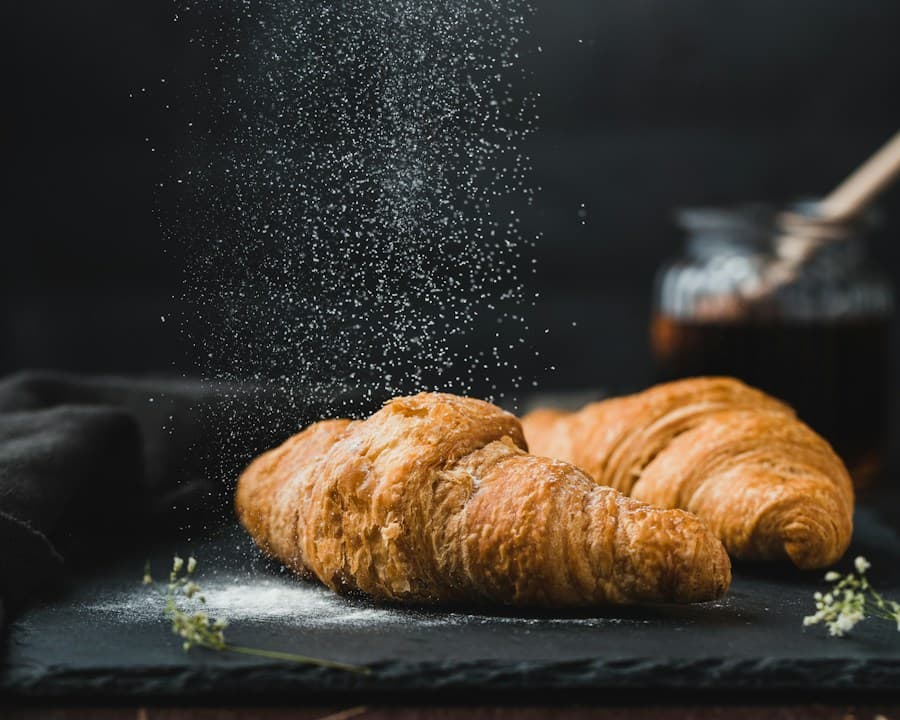Butter croissants dusted with icing sugar